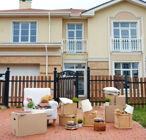 boxes of things in front of a house